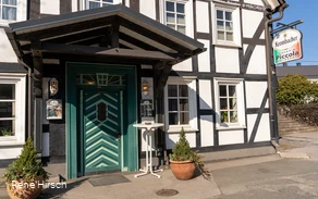 Eingang Pizzeria Piccola in Welschen Ennest